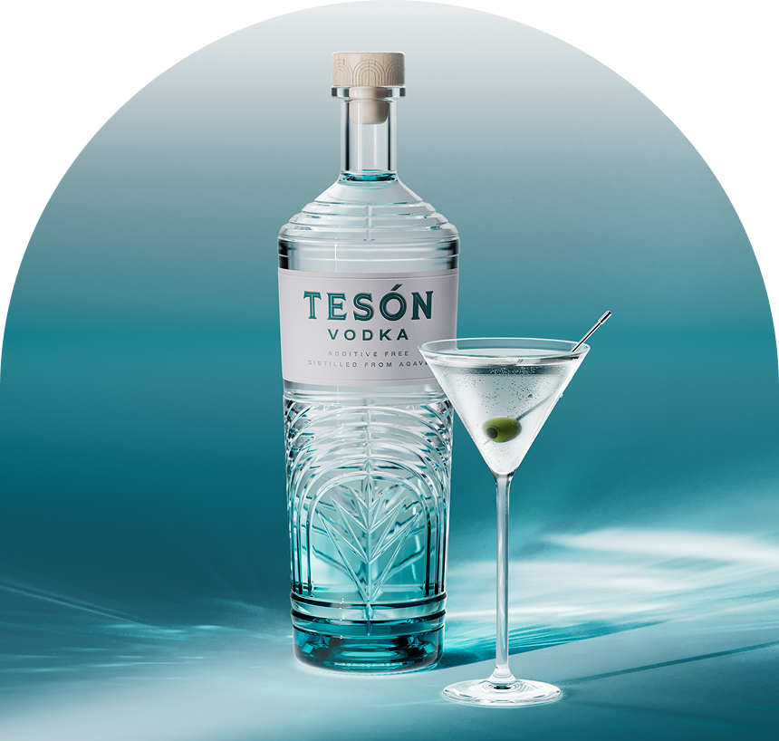 Tesón Vodka bottle alongside a dirty martini cocktail with olive garnish
